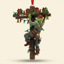 Load image into Gallery viewer, &quot;Light Up the Holidays with a Grinch Twist - Funny Climbing Lineman Wood Ornament - Personalized Gift for Linemen, Electricians, &amp; Gift Givers&quot; Ornament PopCulturePrints
