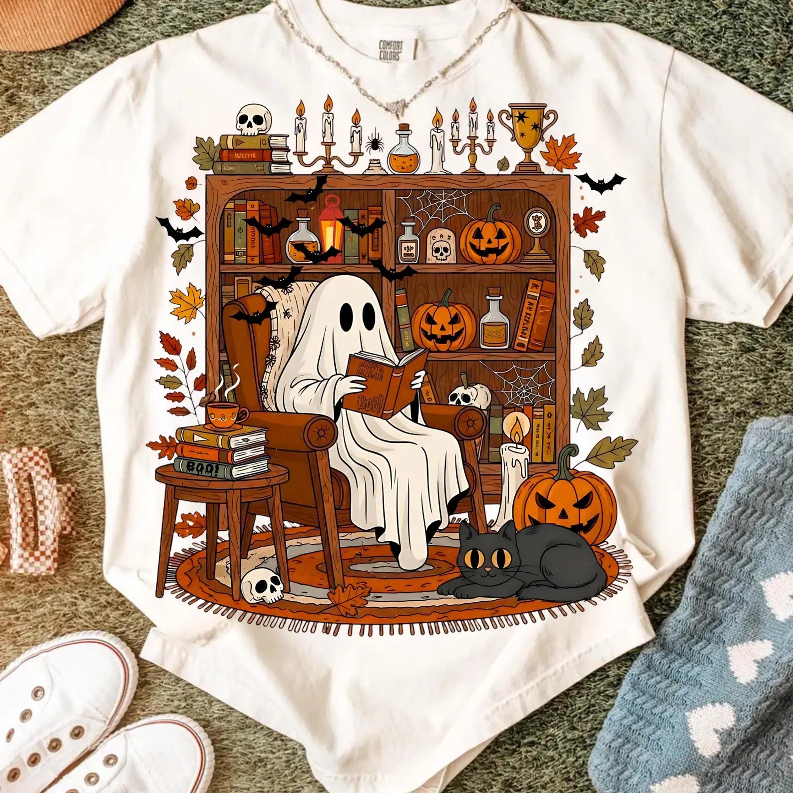 "Read Between the Spooks: Cozy Ghost in Library Tee" - Personalized Gift for Book Lovers & Halloween Enthusiasts Shirts PopCulturePrints