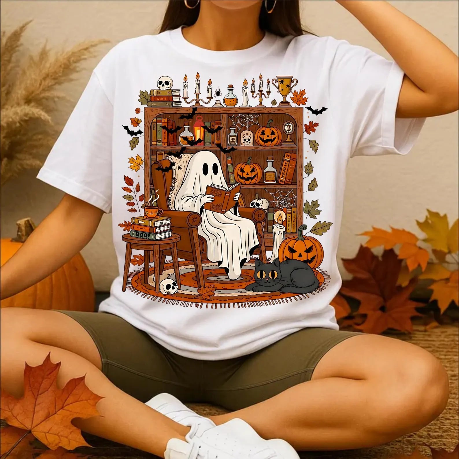 "Read Between the Spooks: Cozy Ghost in Library Tee" - Personalized Gift for Book Lovers & Halloween Enthusiasts Shirts PopCulturePrints