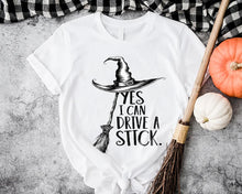 Load image into Gallery viewer, Yes I Can Drive a Stick - Funny Witch Shirt - Customizable Gift for Girlfriend, Wife, or Halloween Enthusiasts Shirts PopCulturePrints
