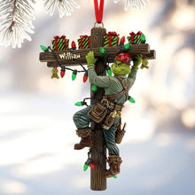 Load image into Gallery viewer, &quot;Light Up the Holidays with a Grinch Twist - Funny Climbing Lineman Wood Ornament - Personalized Gift for Linemen, Electricians, &amp; Gift Givers&quot; Ornament PopCulturePrints
